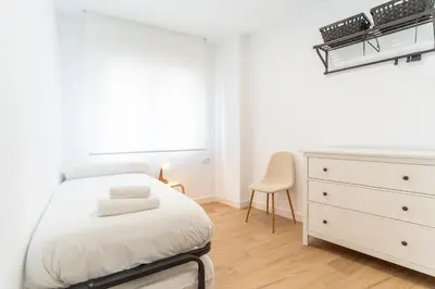 Cama o camas de una habitación en Casa en primera línea de playa, en paseo marítimo