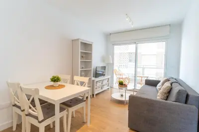 Zona de estar de Casa en primera línea de playa, en paseo marítimo
