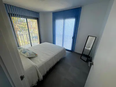 Cama o camas de una habitación en Apartamento en Vera Playa con piscina junto al Mar