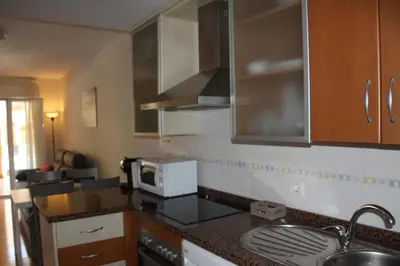 Una cocina o zona de cocina en Vera Playa Bajo 2 Terrazas Jardín Piscina Parking