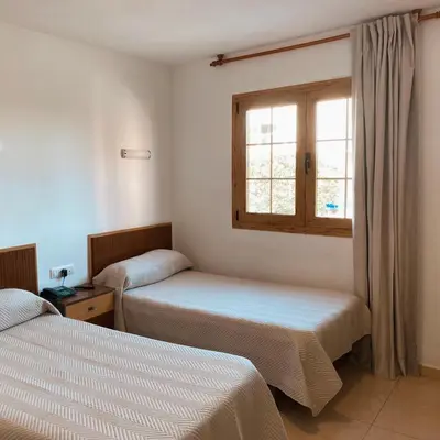 Cama o camas de una habitación en Pensión Torrecárdenas