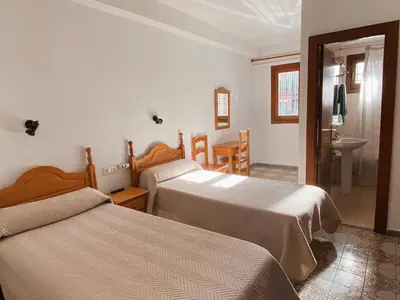 Cama o camas de una habitación en Pensión Torrecárdenas