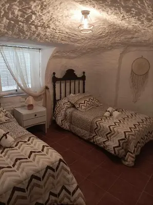 Cama o camas de una habitación en Cueva la Trapera