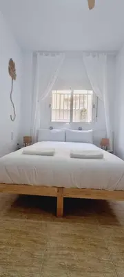 Cama o camas de una habitación en Natural Home Beach - Apartamento con aire