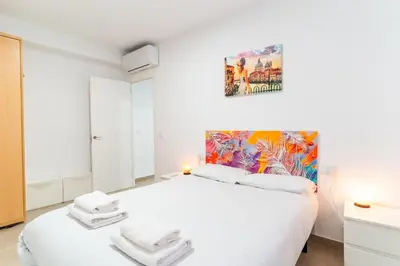 Cama o camas de una habitación en TrendyHomes Almería Playa