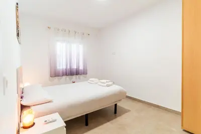 Cama o camas de una habitación en TrendyHomes Almería Playa