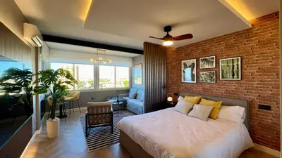 Cama o camas de una habitación en Loft de diseño recién reformado con vistas y ubicación excelente