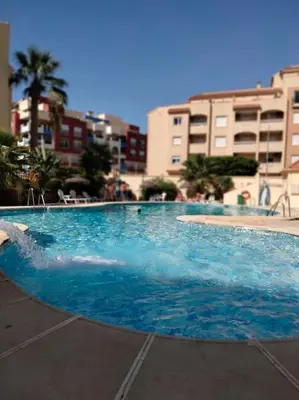 Piscina en o cerca de Apto Roquetas con terraza, a 1min de la playa, garaje y piscina