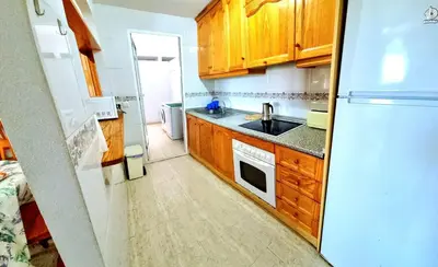 Una cocina o zona de cocina en Apartamento bajo VERAMAR 1 frente a piscina 2 dormitorios