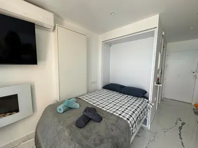 Cama o camas de una habitación en VVR Estudio naturista 1ª línea
