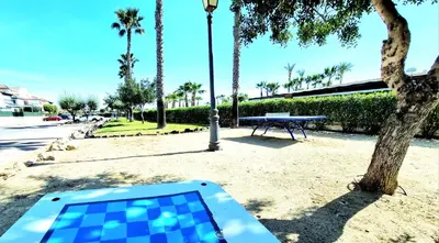 Piscina en o cerca de Apartamento en planta baja Veramar 5 primera línea de playa
