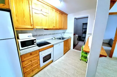 Una cocina o zona de cocina en Apartamento en planta baja Veramar 5 primera línea de playa