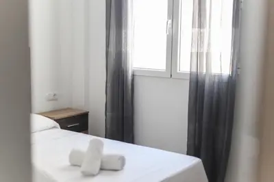 Cama o camas de una habitación en Apartamentos Luna de Águilas