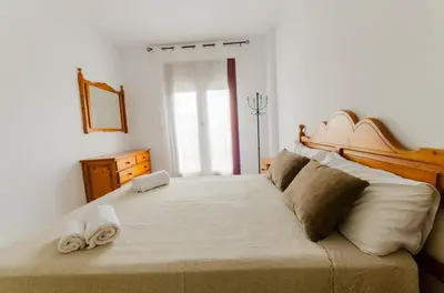Cama o camas de una habitación en Mediterranea 8 Vera Playa Jardines tus momentos frente al mar