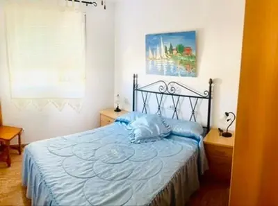 Cama o camas de una habitación en Castillo Suites, Vivienda con Fines Turísticos El Castillo de Roquetas