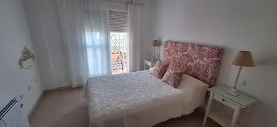 Cama o camas de una habitación en Bonitas vistas al mar y a la montaña