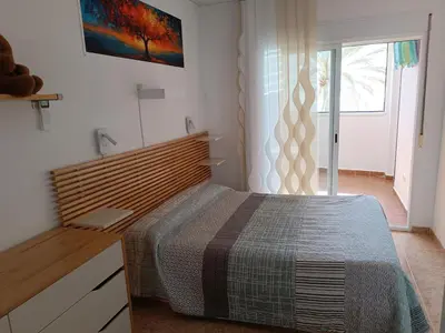 Cama o camas de una habitación en Piso primera línea playa Almería