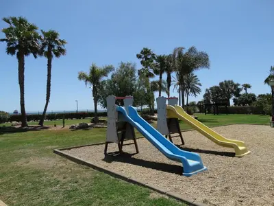Zona de juegos infantil en ÁTICO NUEVO VERA SOLARiUM URBANIZACION A PIE DE PLAYA