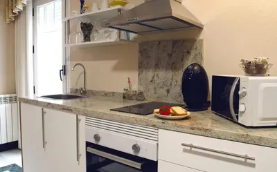 Una cocina o zona de cocina en Casa Del Sol y la Luna Apartamento Medio Día