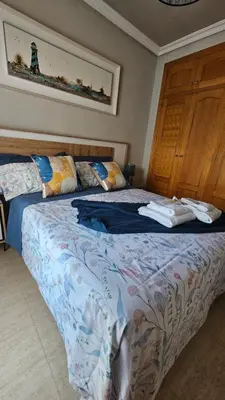 Cama o camas de una habitación en Piso Costa de Almeria Retamar