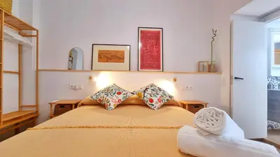 Cama o camas de una habitación en Rincón céntrico con encanto By Aloha Palma