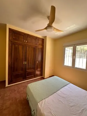 Cama o camas de una habitación en Casa Rural El Pomelo