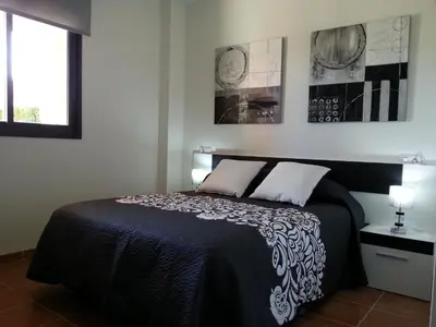 Cama o camas de una habitación en Apartamento unifamiliar Golf Vera urb privada y tranquila