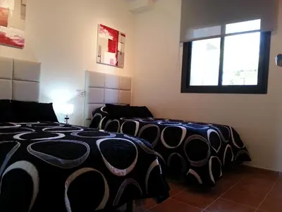 Cama o camas de una habitación en Apartamento unifamiliar Golf Vera urb privada y tranquila