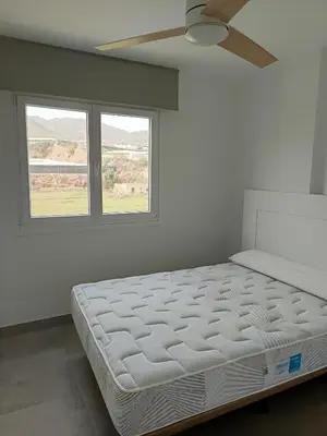 Cama o camas de una habitación en Piso en Primera línea de playa