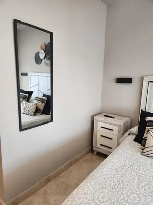 Cama o camas de una habitación en Bajo con vistas a la piscina en Valle del Este Golf