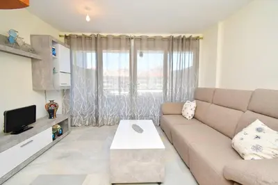 Una televisión o centro de entretenimiento en Expoholidays - MAGNIFICO APARTAMENTO CON VISTAS AL PUERTO
