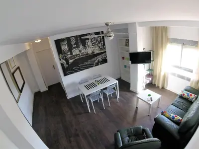 Una televisión o centro de entretenimiento en Apartamento Puerta Purchena Almeria