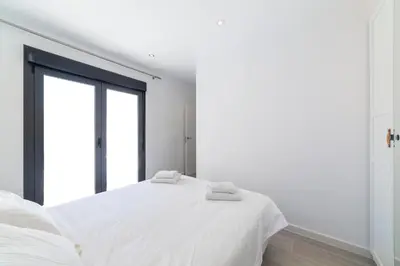 Cama o camas de una habitación en TrendyHomes Palmeral Beach Mojacar