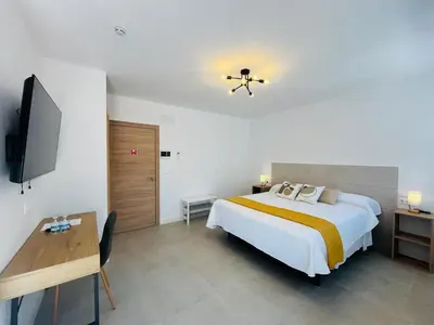 Cama o camas de una habitación en HOTEL MUSEO Lucainena