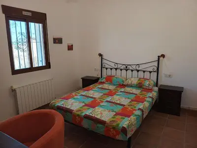 Cama o camas de una habitación en El Oasis Morado