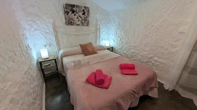 Cama o camas de una habitación en Cueva Rincón Bustamante