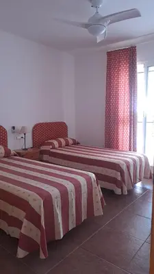 Cama o camas de una habitación en Mojacar apartamento amplio y tranquilo