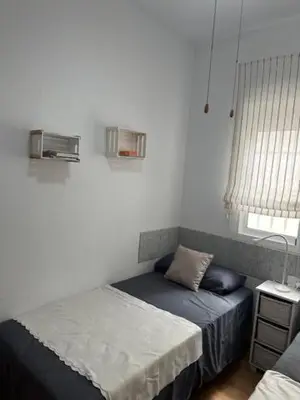 Cama o camas de una habitación en Piso Caramel