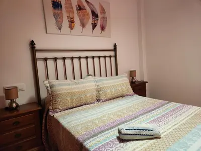 Cama o camas de una habitación en Casa Baja tranquila con terraza y jardín en Vera-Playa naturista!