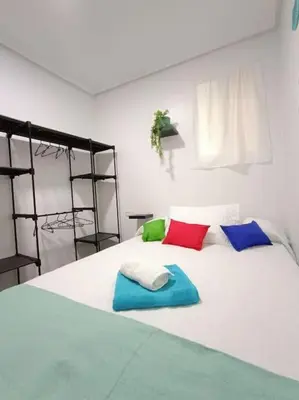 Cama o camas de una habitación en casita en playa de la colonia