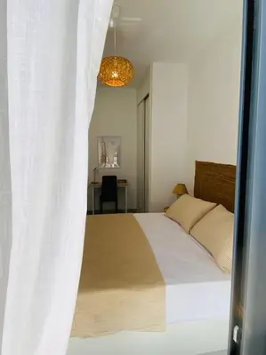 Cama o camas de una habitación en Aire del mediterráneo- Garrucha