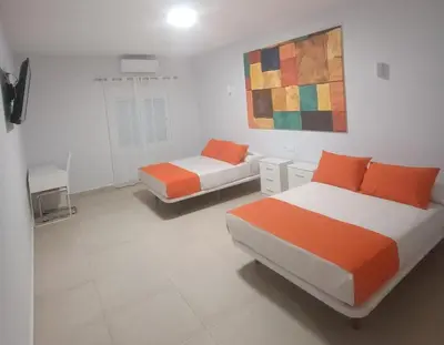 Cama o camas de una habitación en Hostal El Encuentro