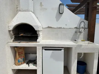 Una cocina o zona de cocina en Atico duplex con piscina privada, solárium y barbacoa