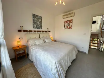 Cama o camas de una habitación en ViveVera - Chalet Palmera Golf Valle del Este