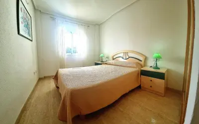 Cama o camas de una habitación en Apartamento 2 dormitorios soleado Veramar 5, 1ª planta