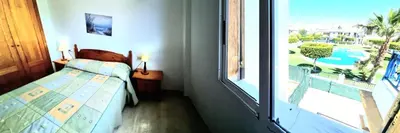 Cama o camas de una habitación en Ático VERAMAR 1 frente a piscina dos dormitorios