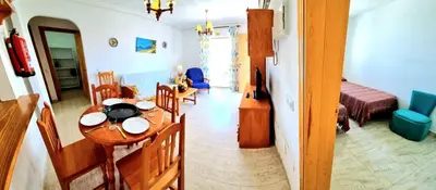Zona de estar de Ático VERAMAR 1 frente a piscina dos dormitorios