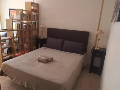 Cama o camas de una habitación en Estudio con terraza junto al mar