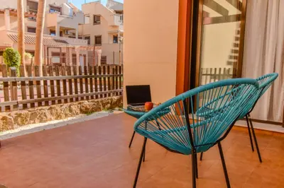 Un balcón o terraza de Los Collados con Jardín y Piscina By Aloha Palma