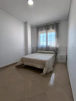 Cama o camas de una habitación en APARTAMENTO TURISTICO 1ºA CARLOS III - Cerca de la playa